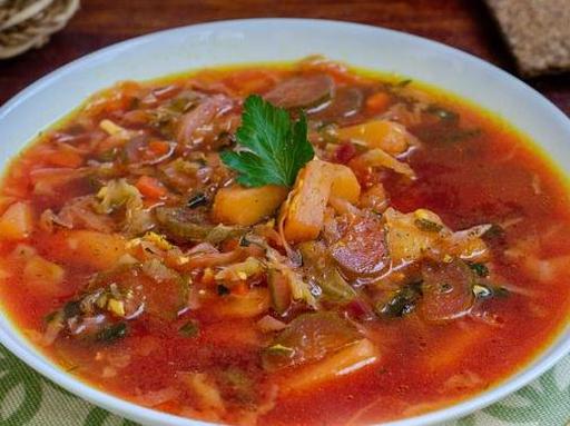 Beetroot Soup with Cabbage, Pickled Cucumbers, and Feta Cheese